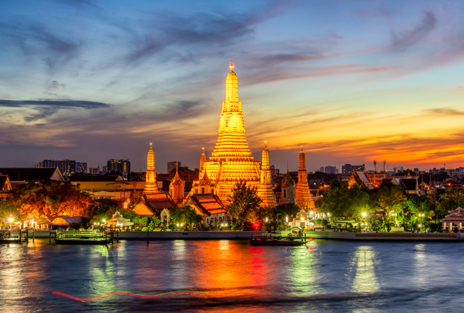 Wat Arun Buddhist religious places lit up at twilight, Bangkok, Thailand