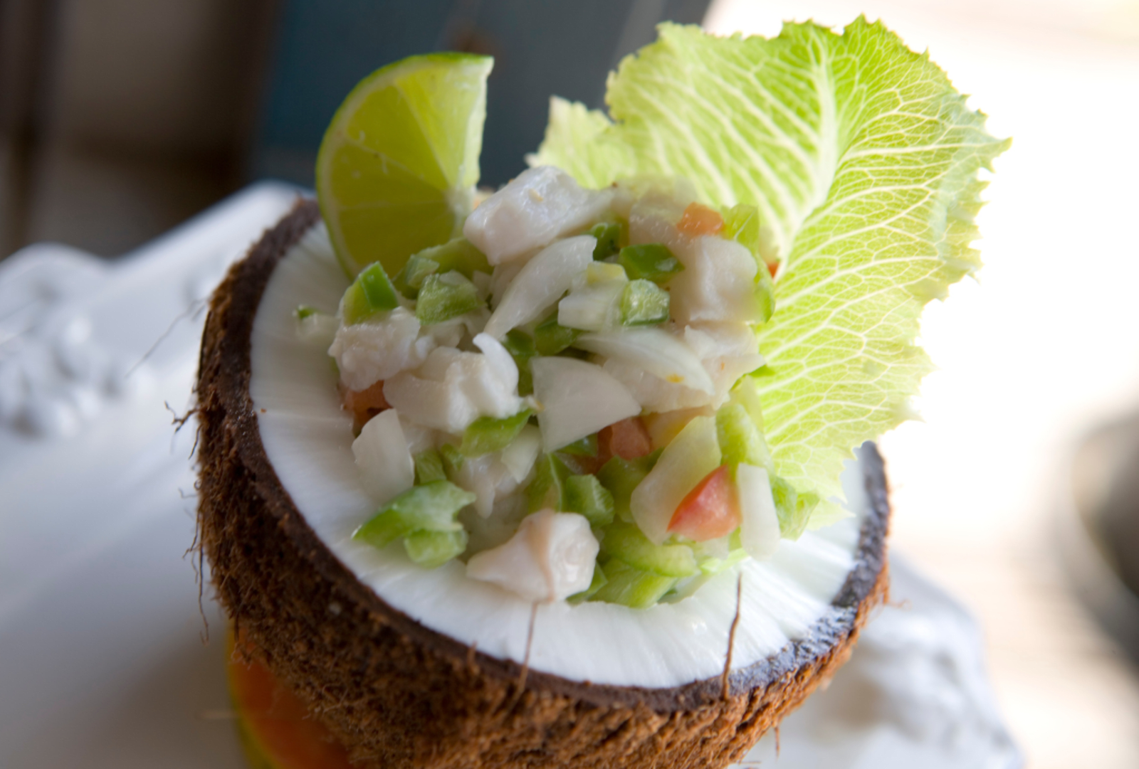 Marinated fish salad served in coconut