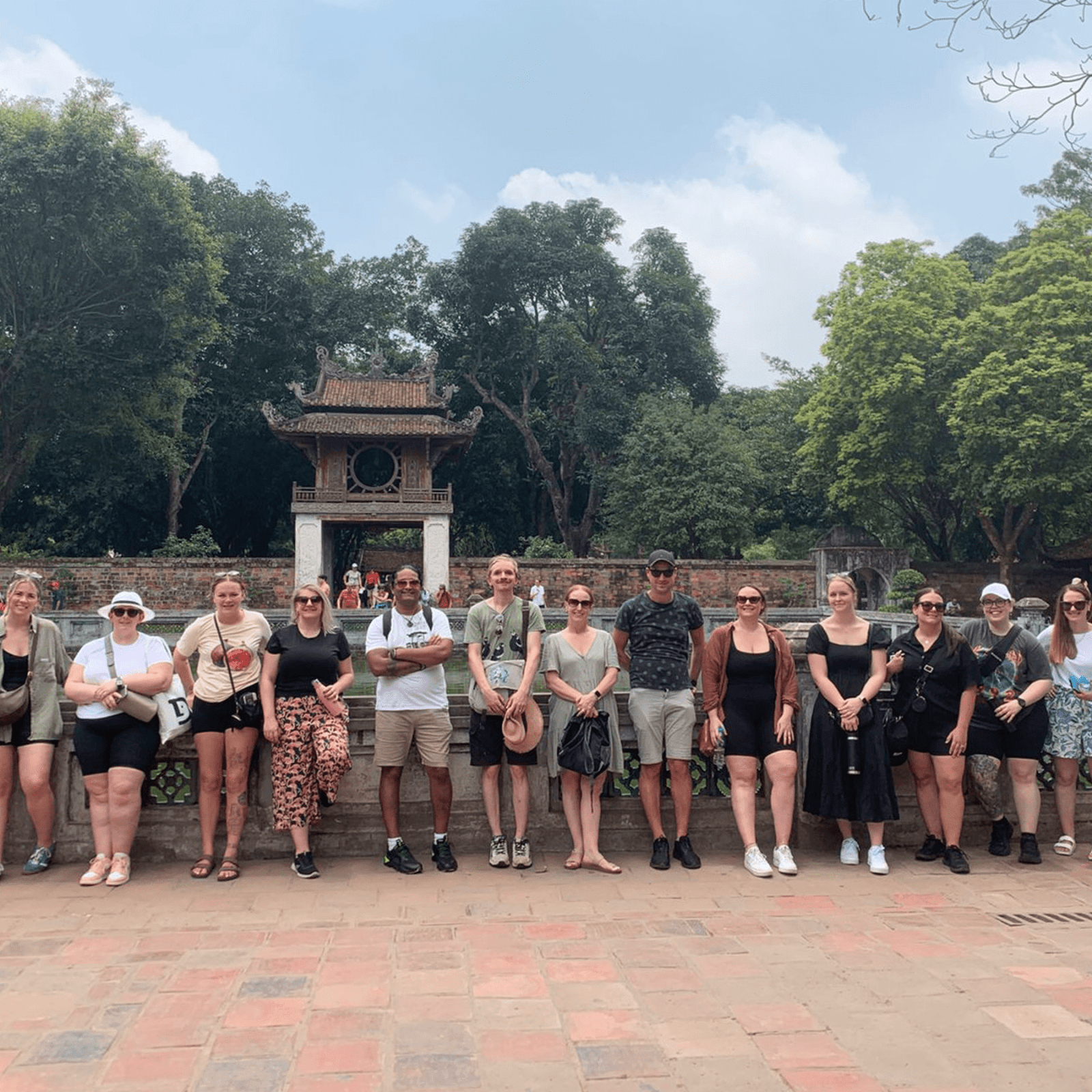 Group of tourists in the Temple of Literature in Hanoi, Vietnam