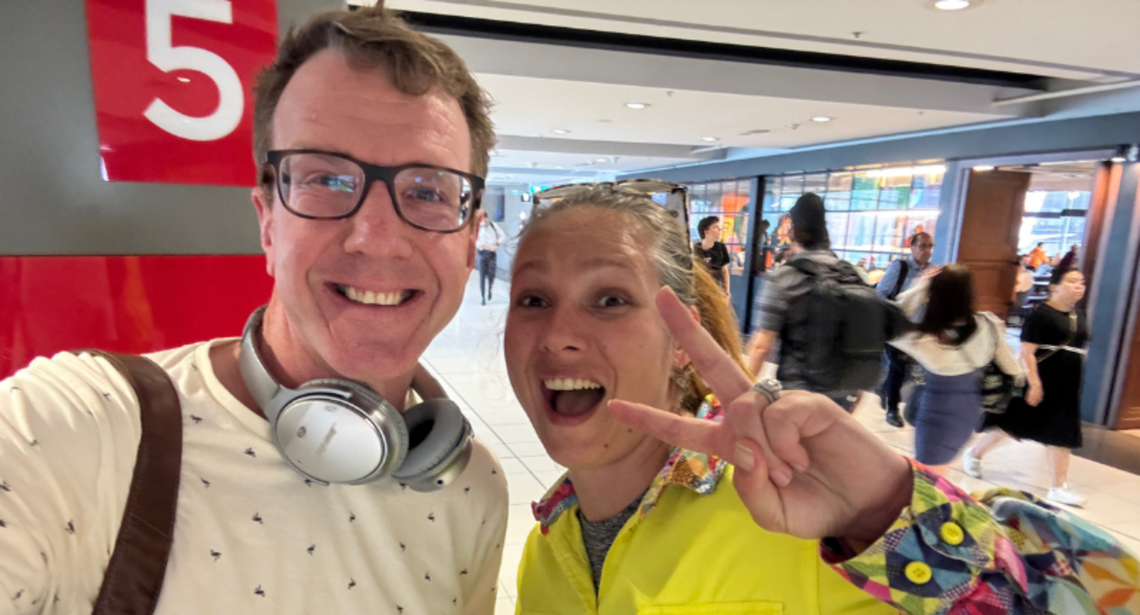Two people taking a selfie at the airport