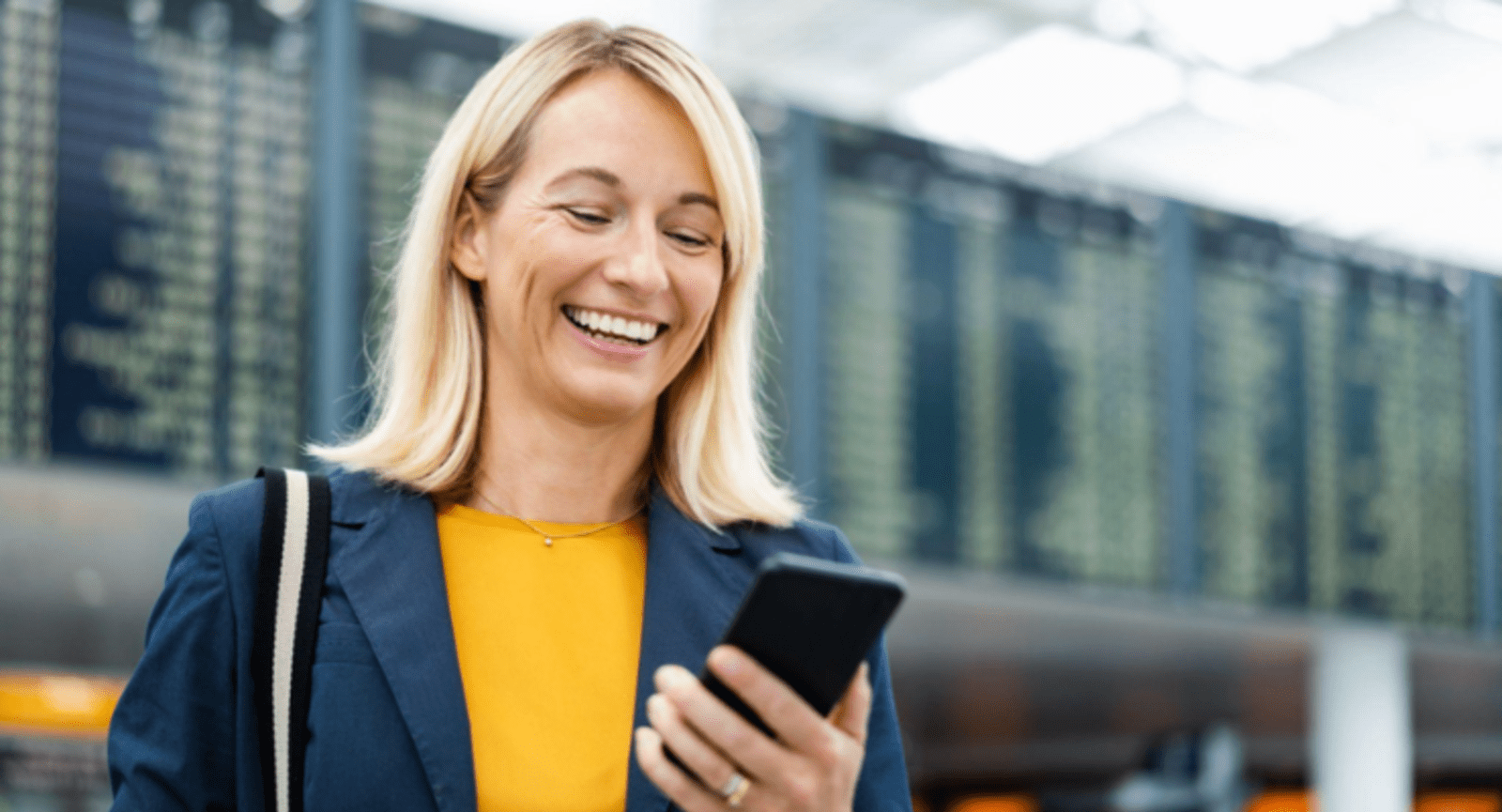 Businesswoman smiling at her phone