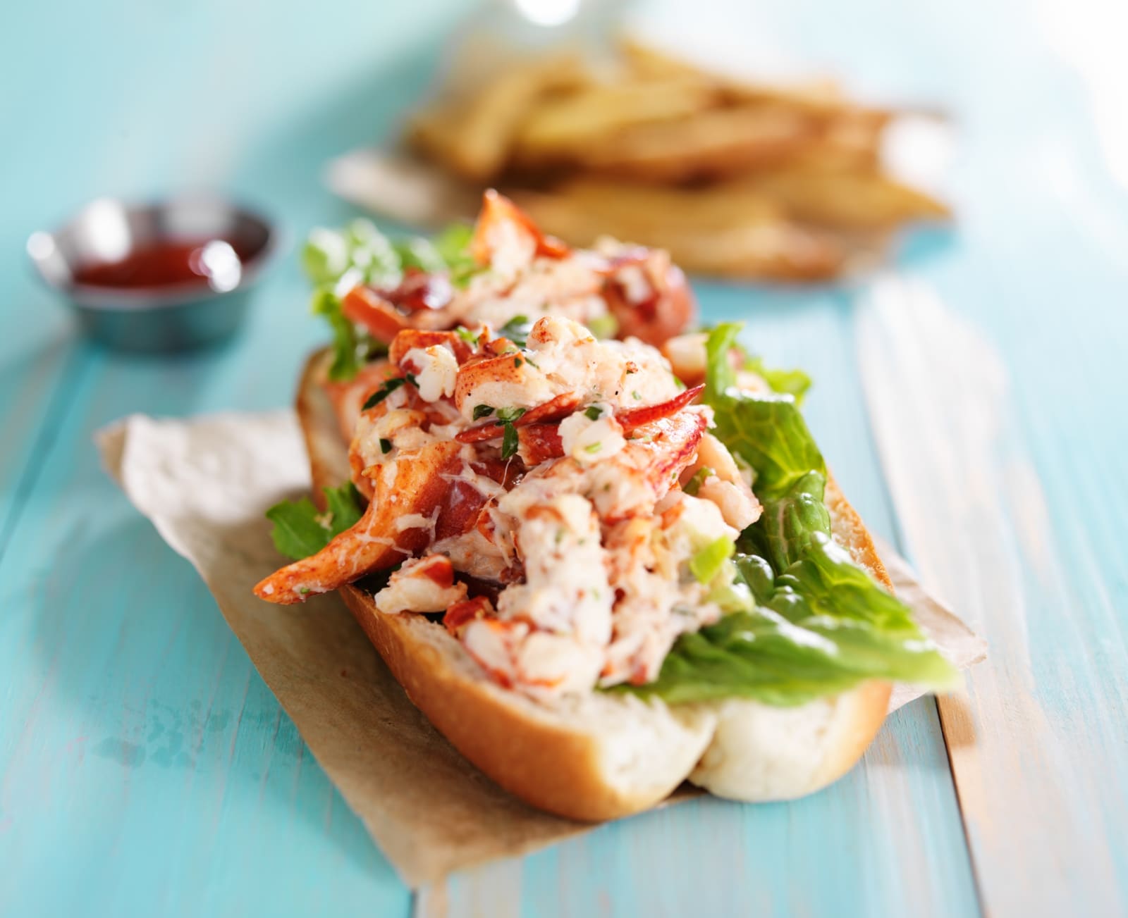 Lobster roll on colourful retro painted wooden planks