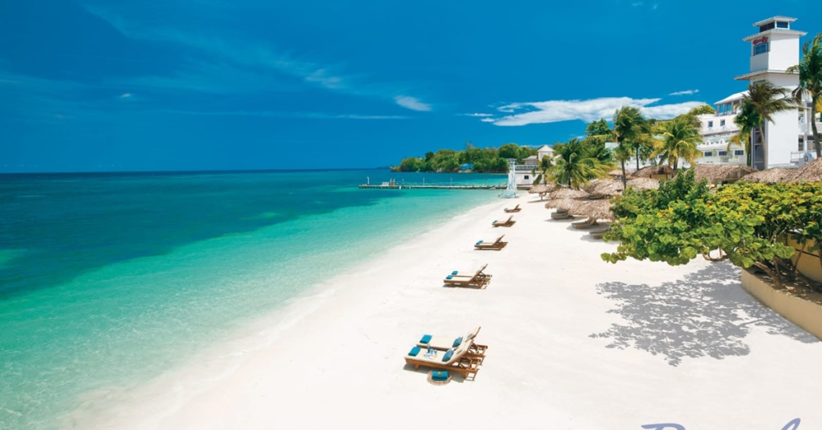 Beach in Jamaica lined with deck chairs