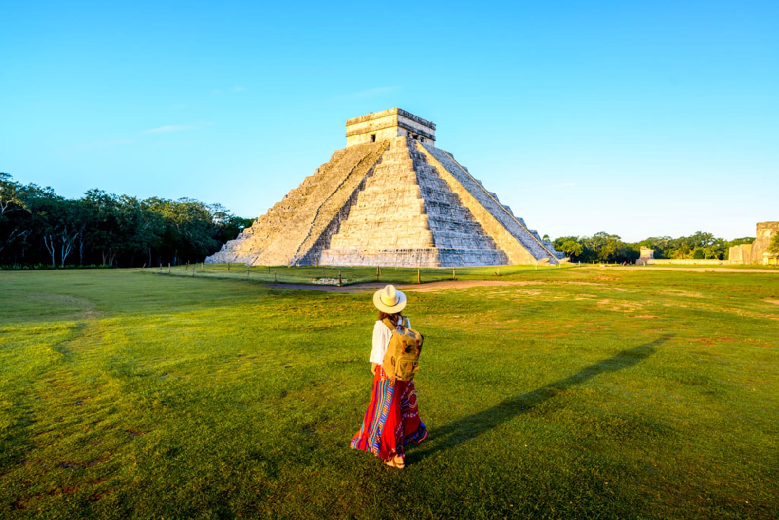 Woman admiring the Temple of Kukulcan (El Castillo) in Chichen Itza