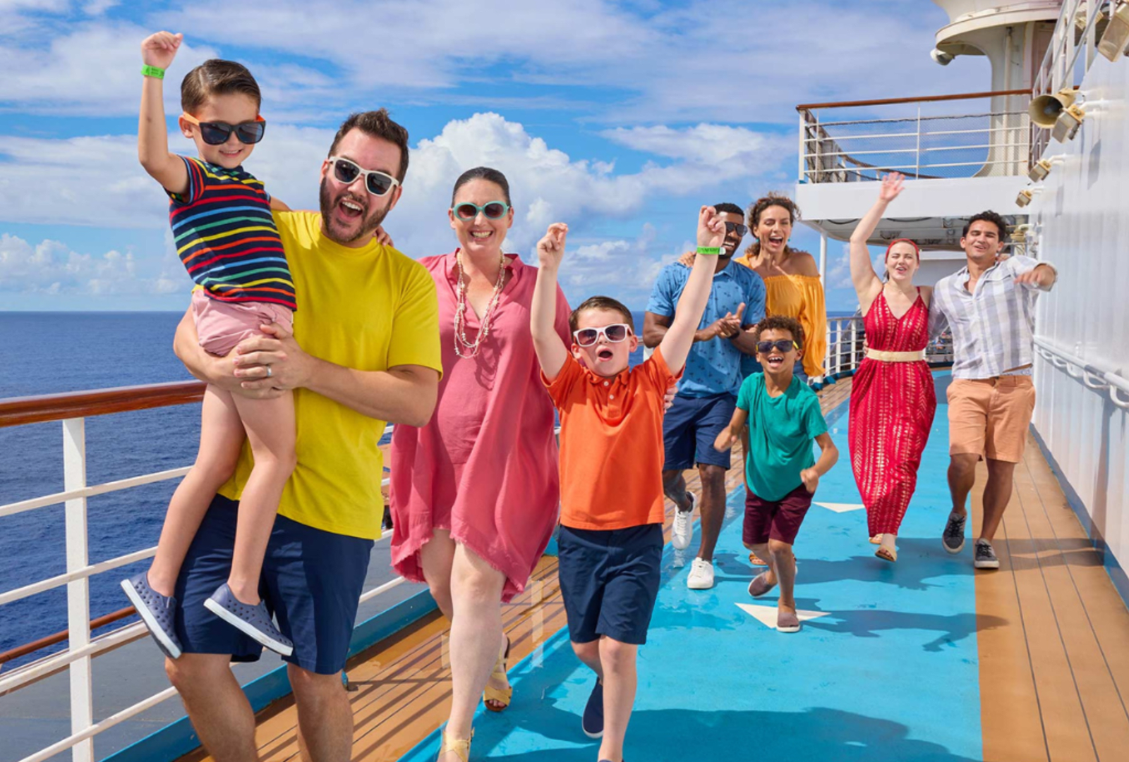 Jubilant families walking on the deck of a cruise ship