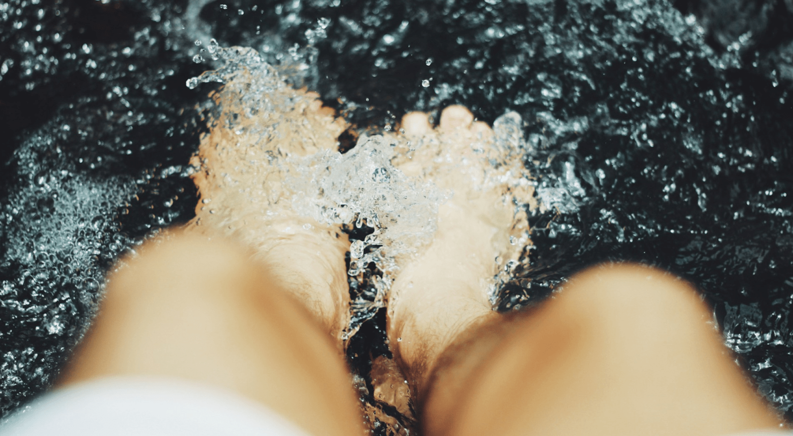 Feet in a bubbling spa bath