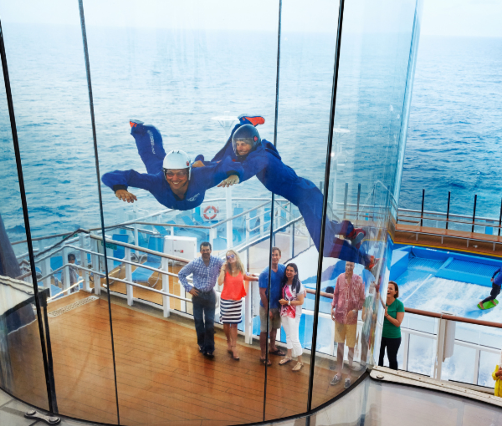 Two people indoor skydive high on deck