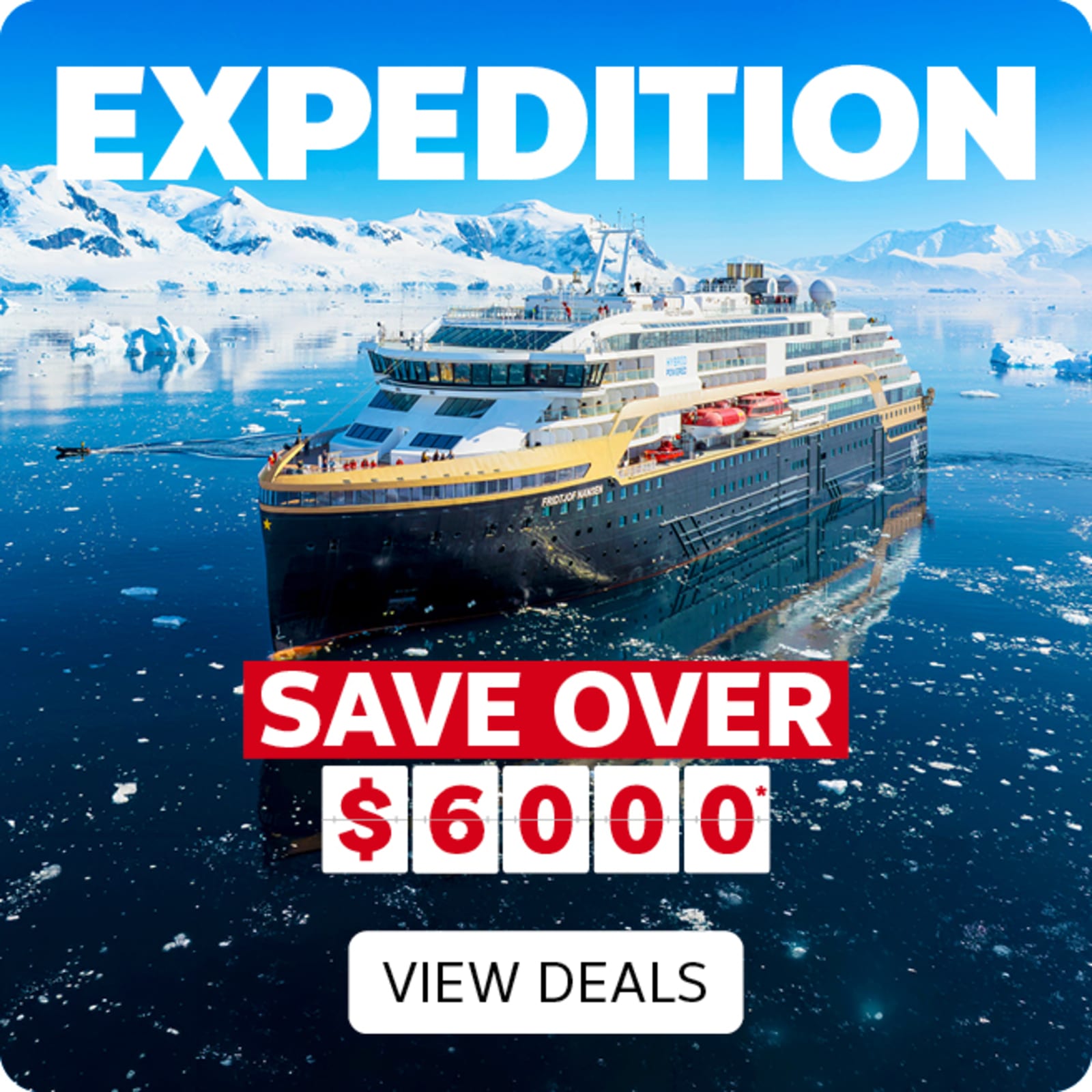 Expedition cruise ship sailing through icy Antarctic waters surrounded by icebergs and snow capped mountains