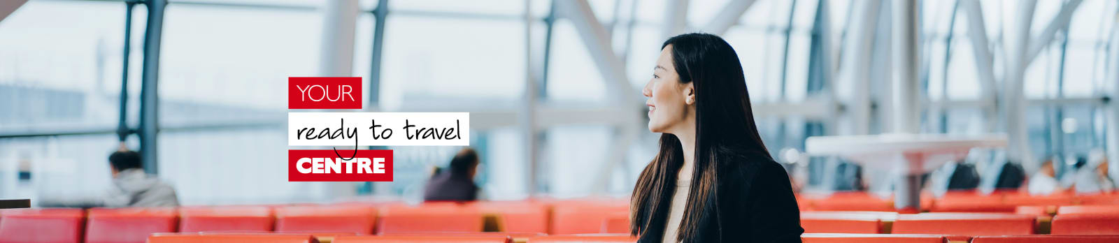 Your ready to travel centre - Asian businesswoman on a red chair waiting at an airport holding a tablet