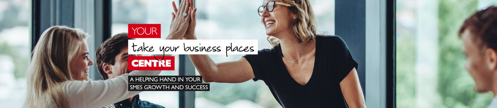 Your take your business places centre - A helping hand in your SMEs growth and success. Businesswomen high-fiving in a meeting room