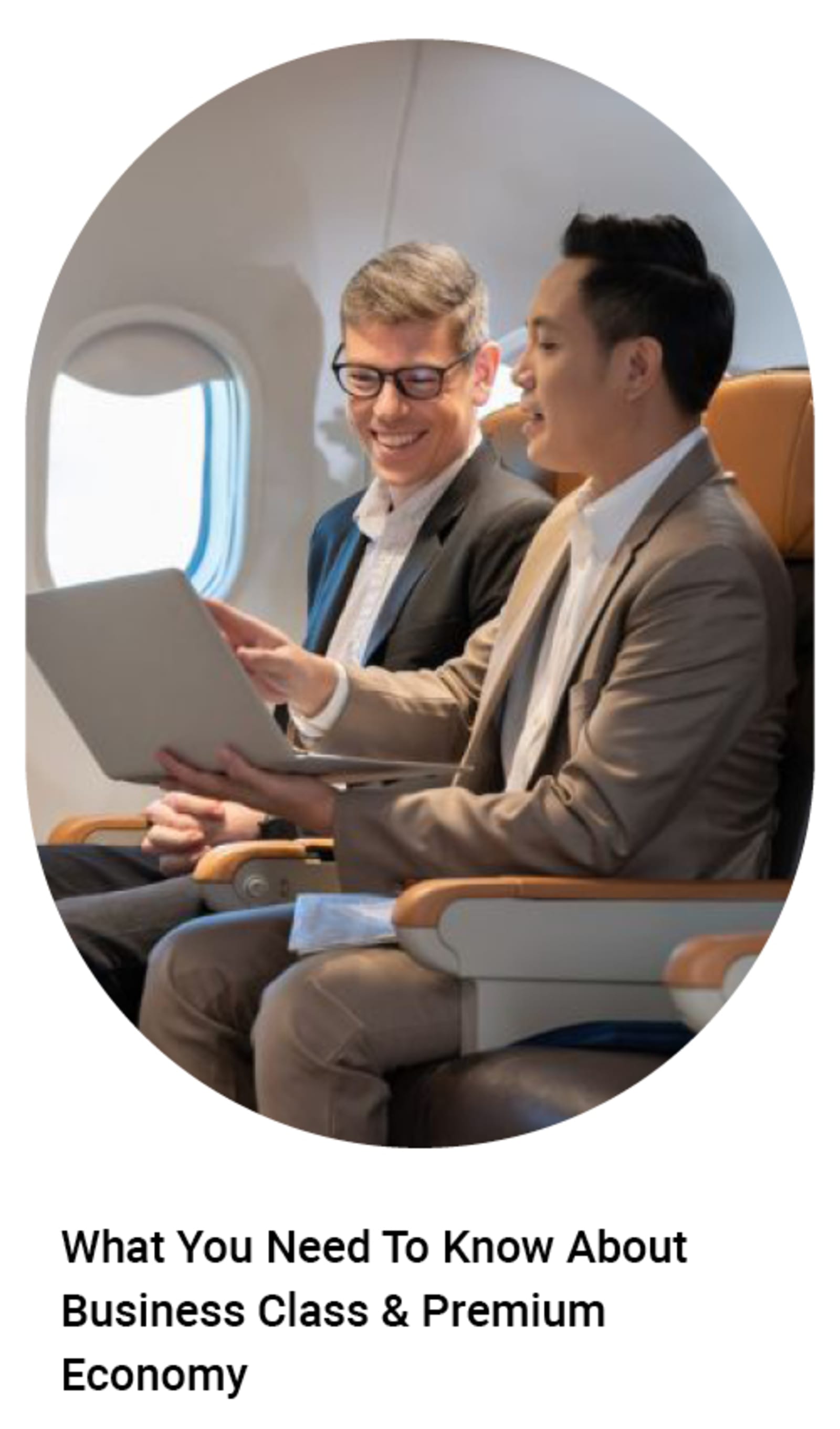 Two businesspeople on a plane - What you need to know about business class & premium economy