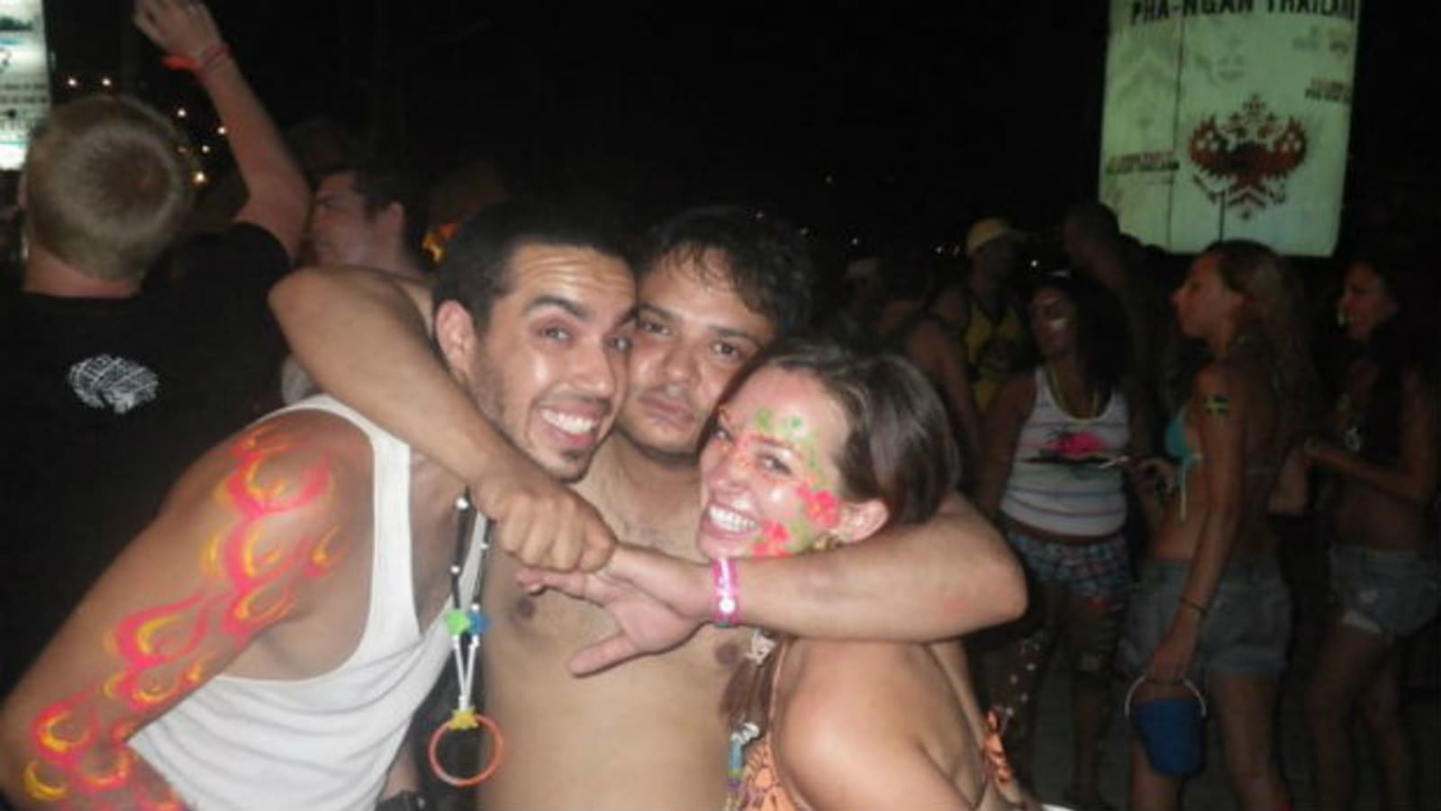 Young adults dancing and celebrating at a Moon party