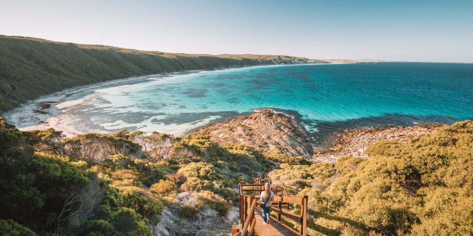 Overlooking a beach surrounded by greenery