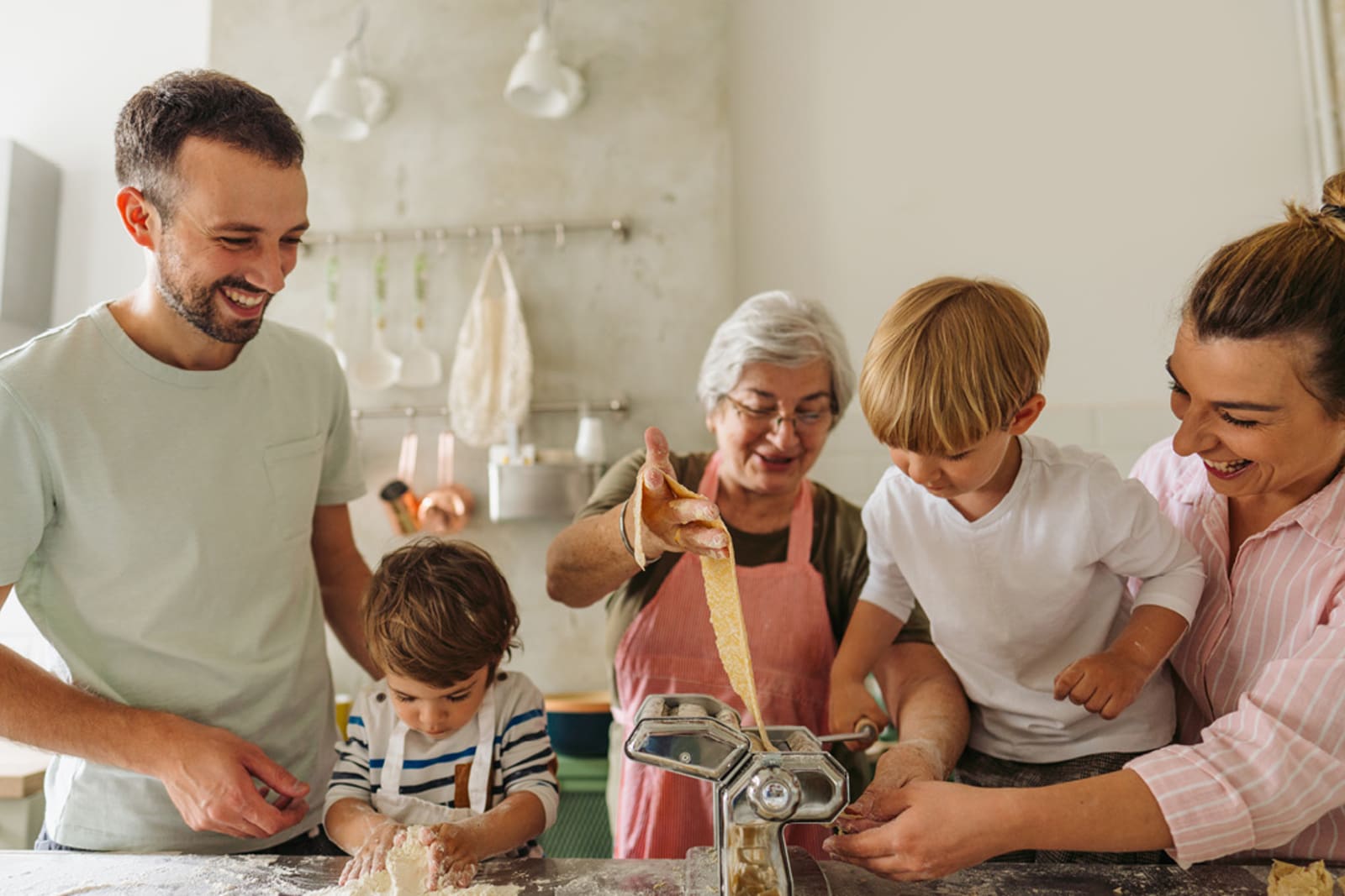 An Italian grandmother teaching her family how to make fresh pasta