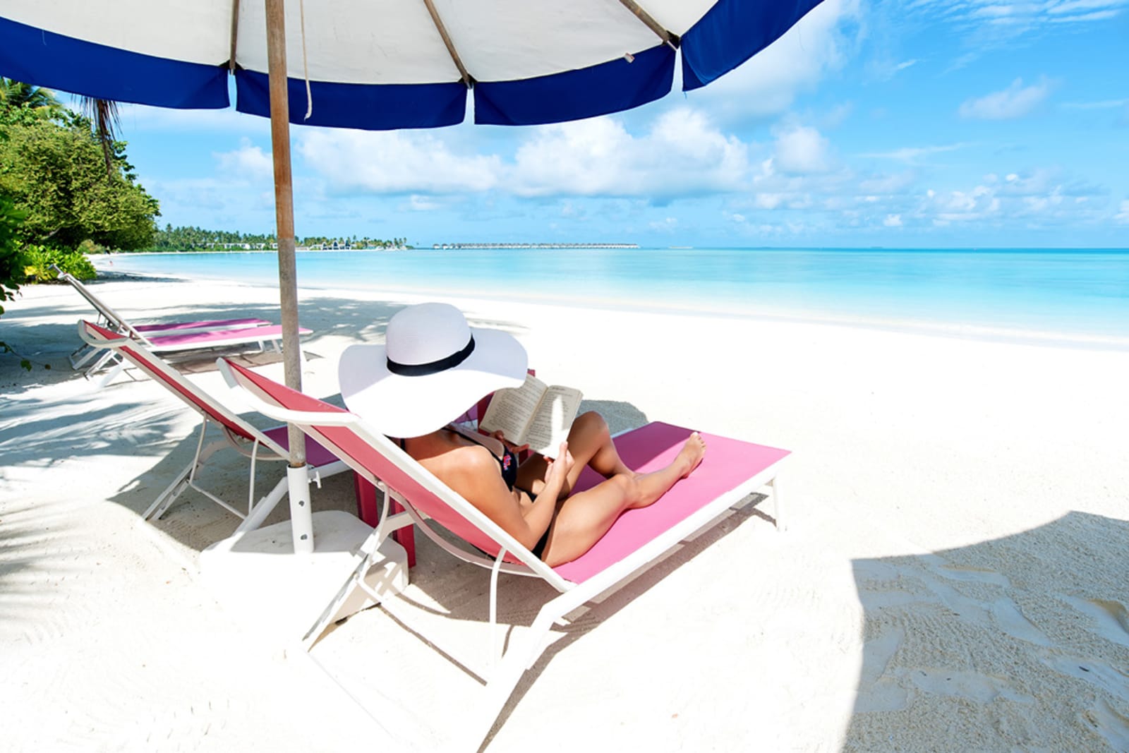 A woman reading on a beach in Mexico