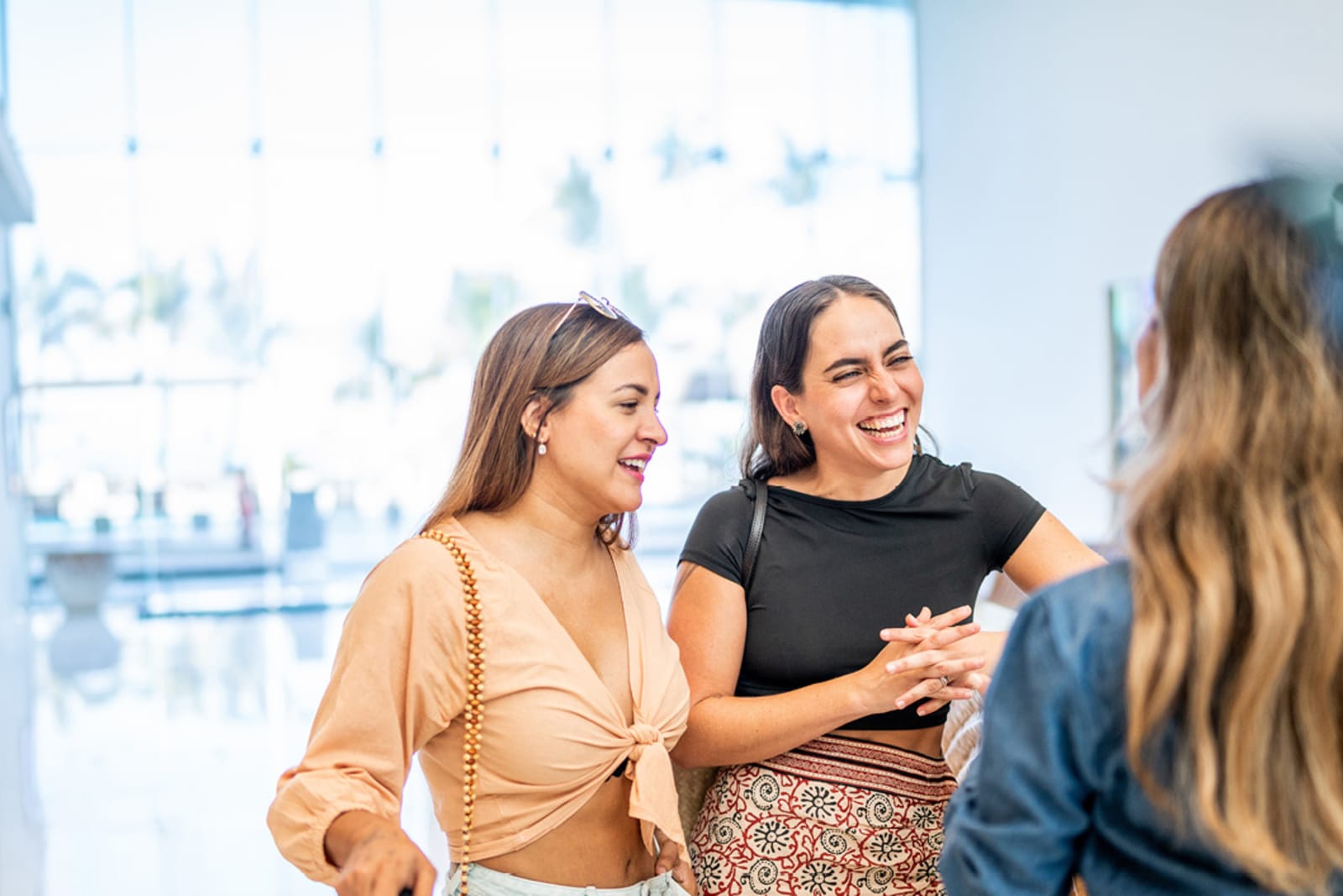 An engaged couple speaking to a resort's destination wedding coordinator