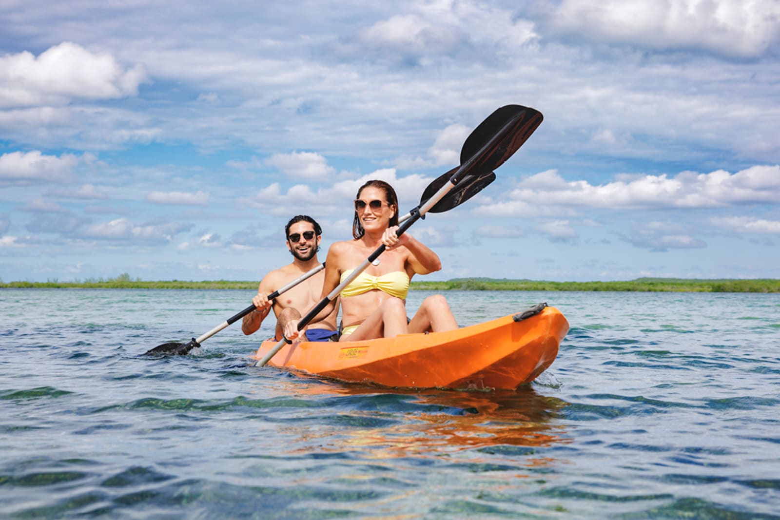 A couple kayaking at Princess Cays, Princess Cruises' private island