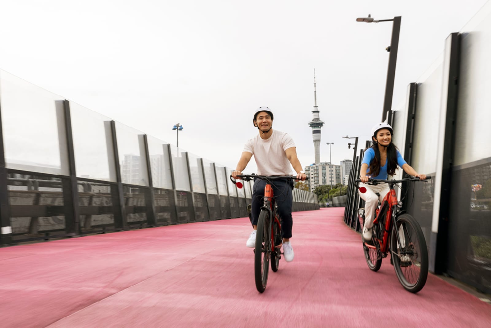 A couple of individuals cycling in Auckland city centre