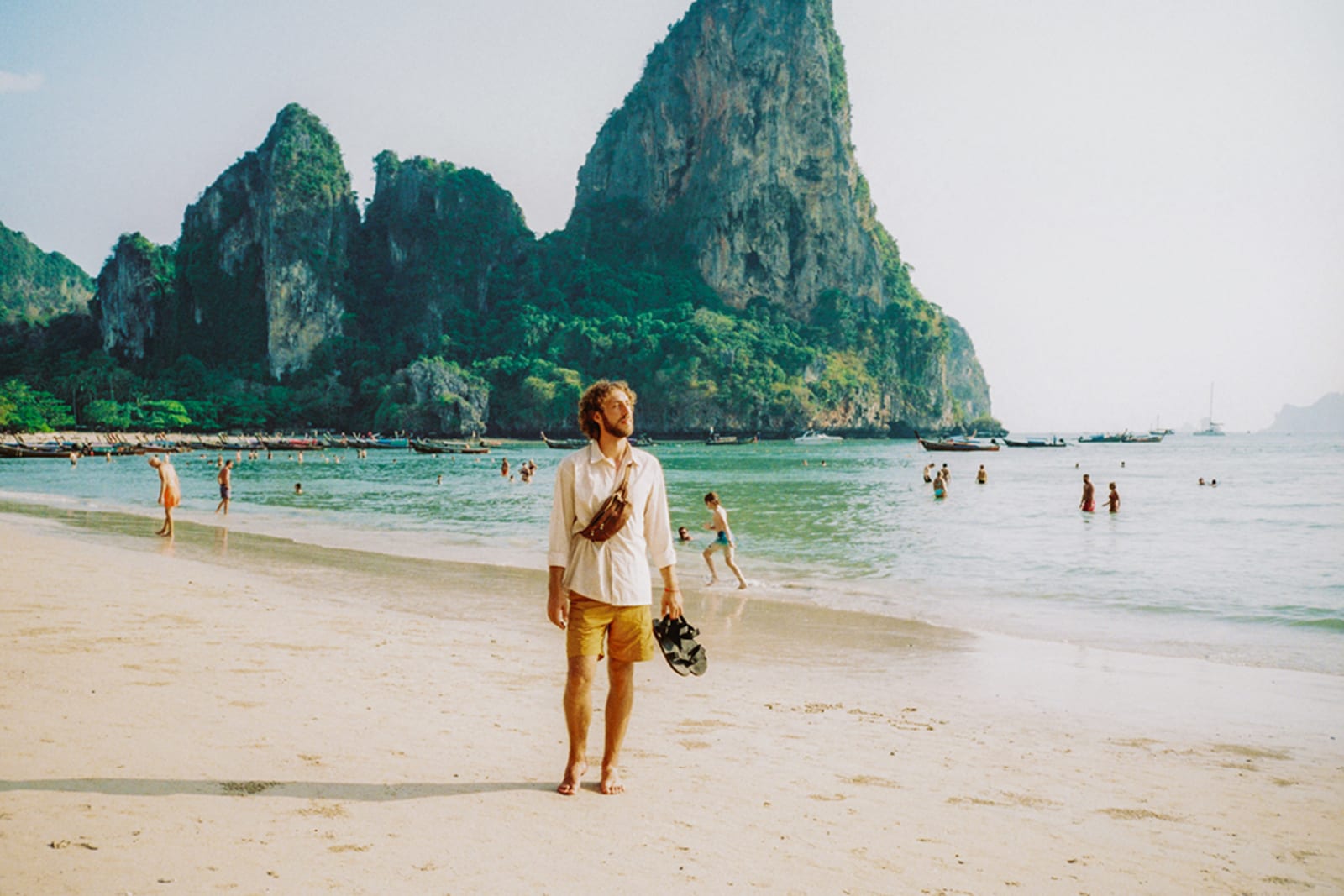 A traveller walking on a beautiful beach in Phuket, Thailad