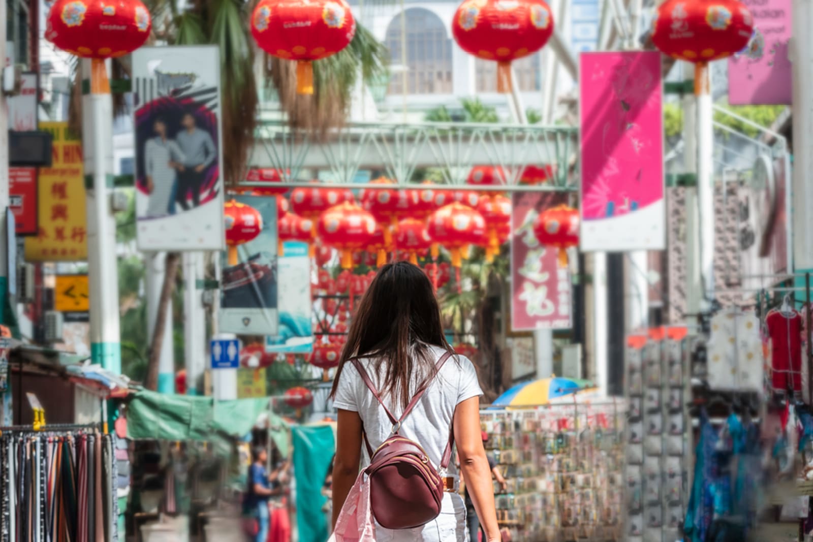 A woman wandering through a market in Kuala Lumpur, Malaysia