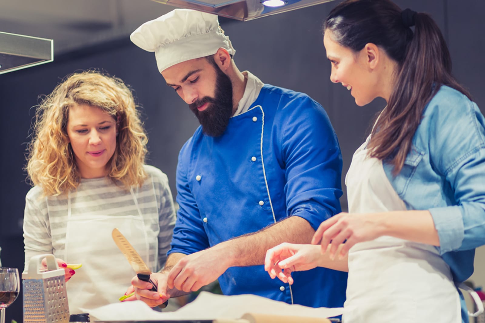 A couple learning to cook Dominican Republic cuisine at a private cooking class