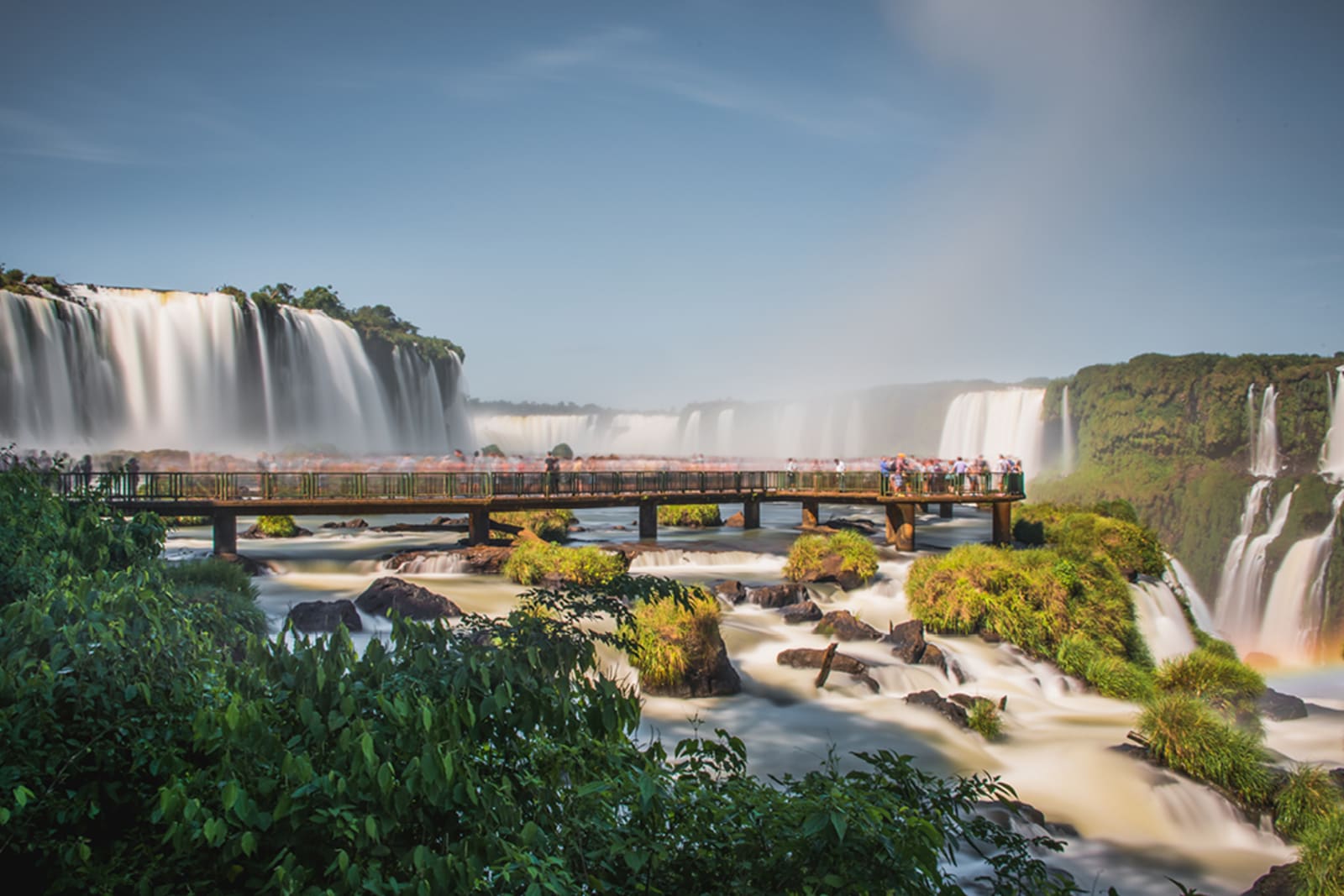 A group of people on a viewing platform at Iguazú Falls