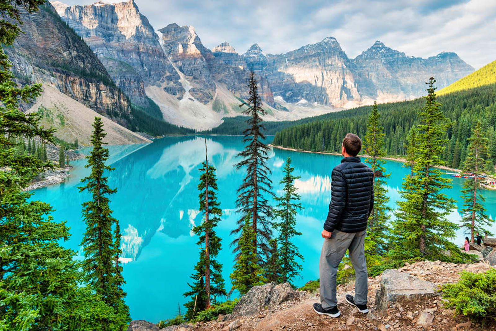 A hiker overlooking Lake Moraine in Banff National Park, Alberta