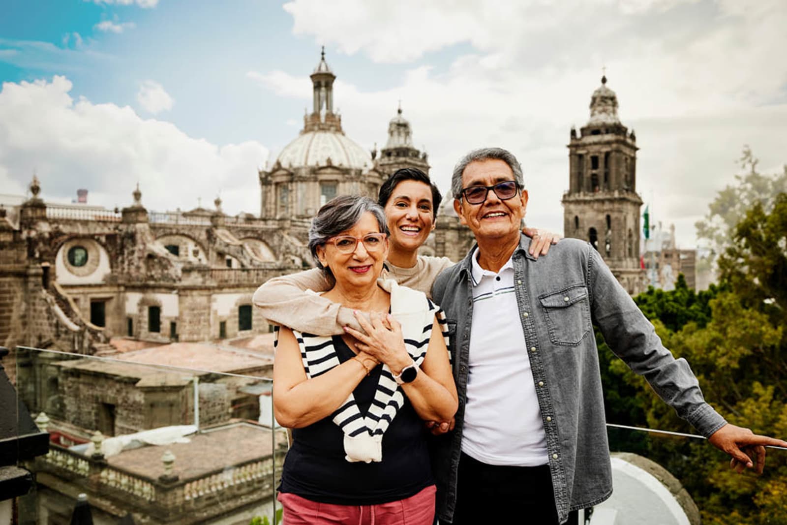 Elderly parents with their adult daughter on vacation