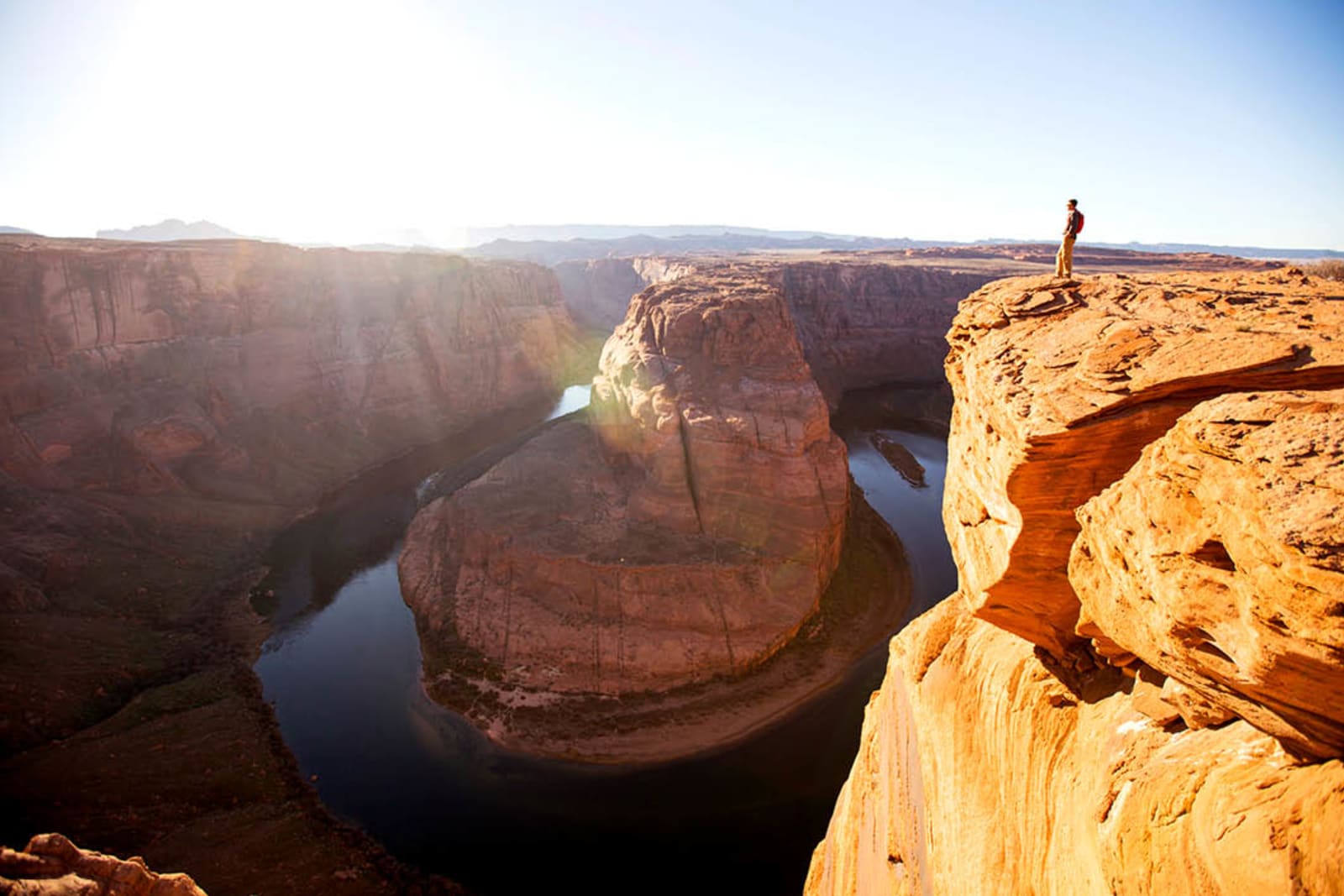 A person taking in the epic views from the Grand Canyon rim