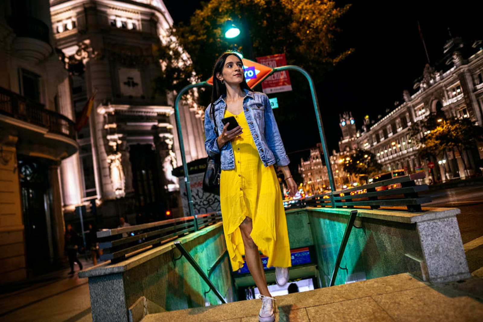 A woman exiting a metro station in Spain
