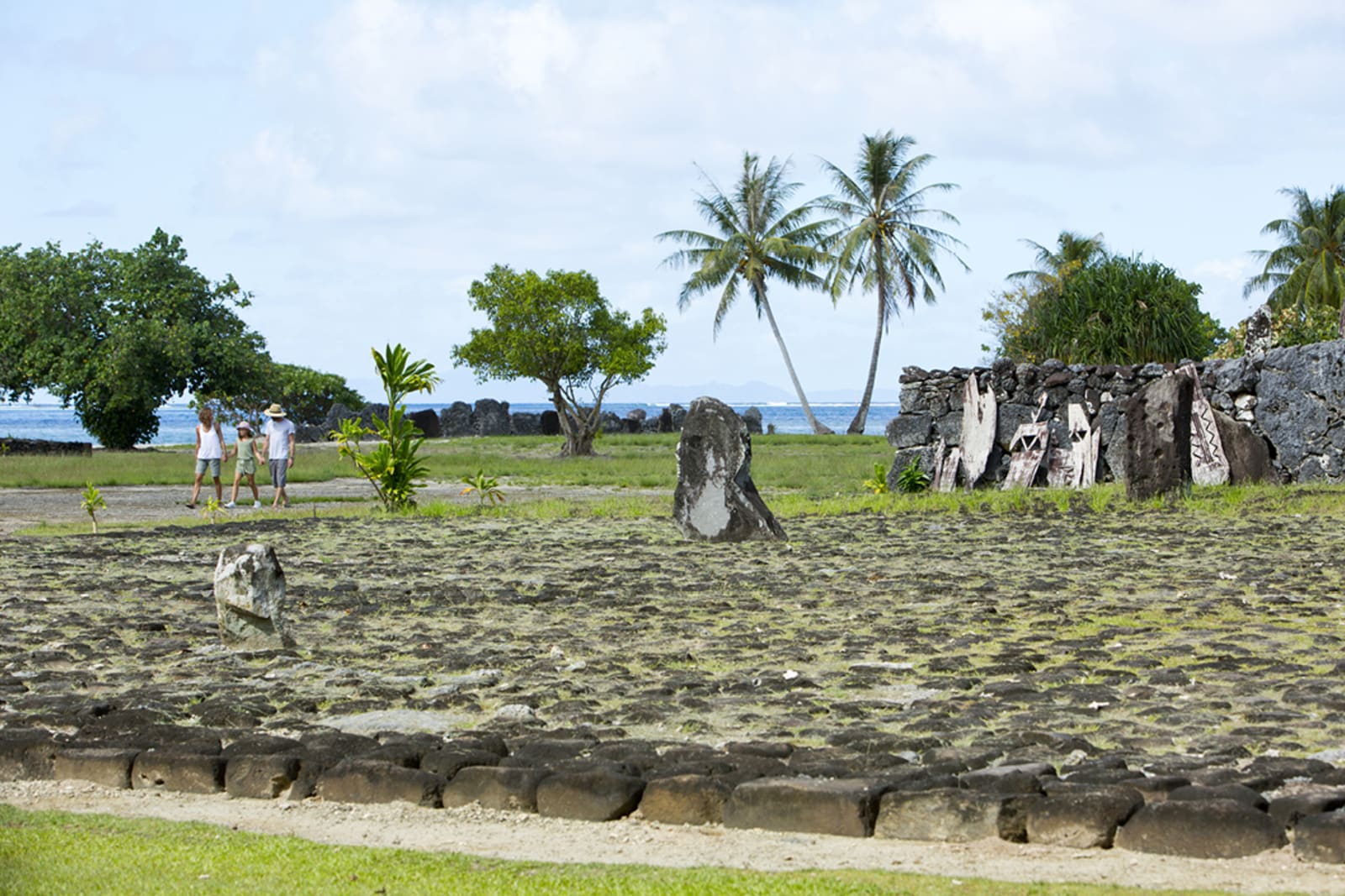 People exploring the temple of Taputapuatea in Raiatea