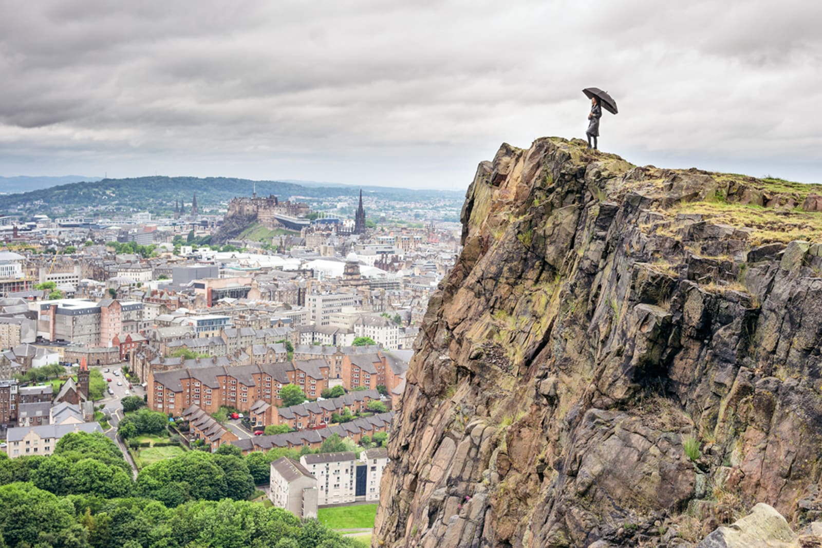 Woman looking over Edinburgh from Holyrood Park