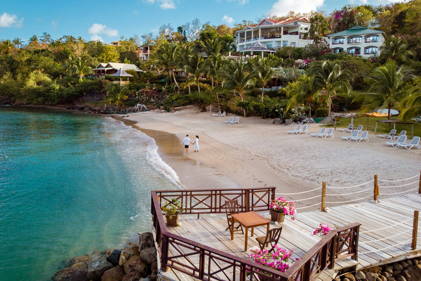 Couple walking on a beach in Saint Lucia