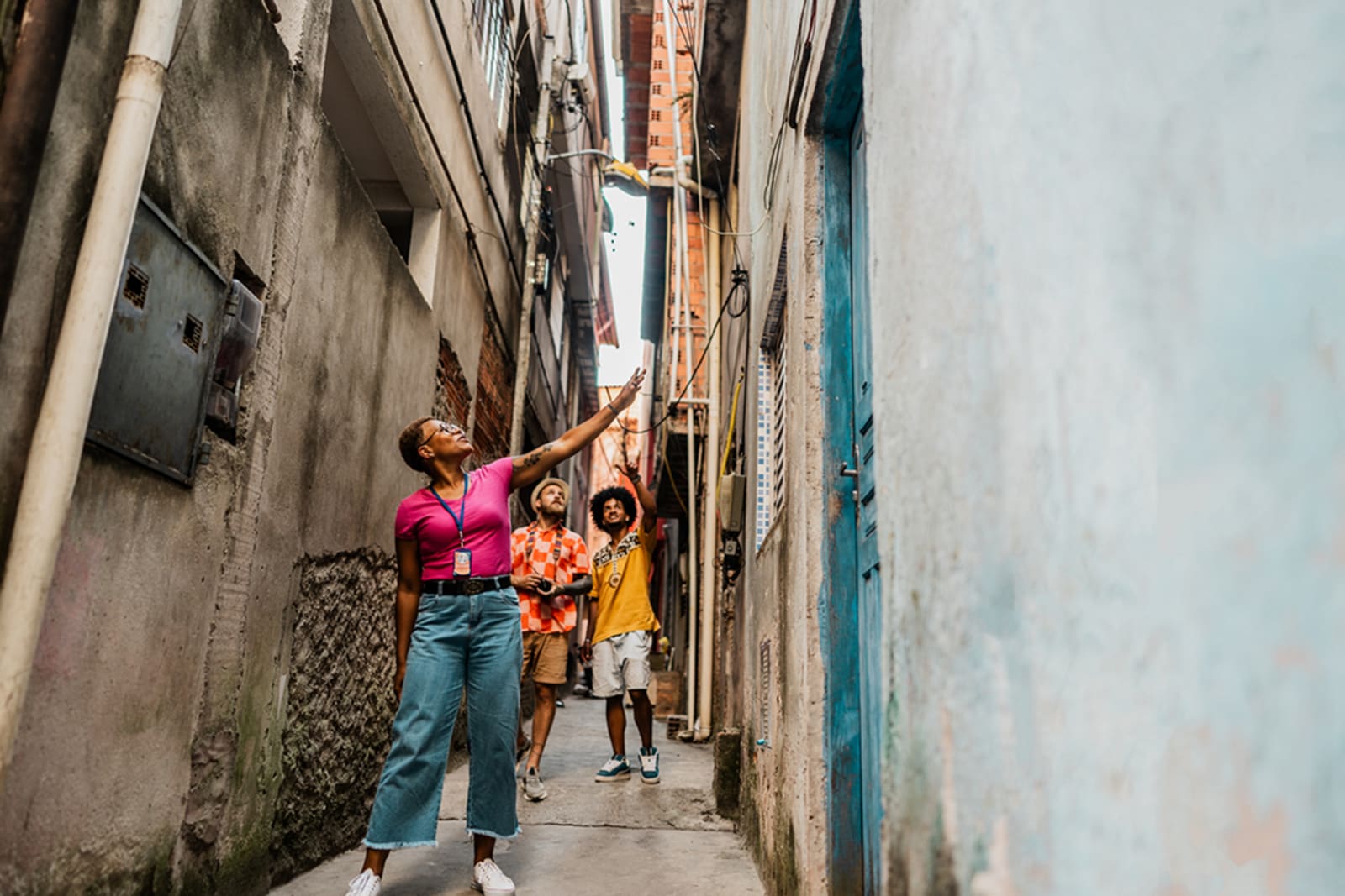 Tour guide leading travellers through unique alleyway