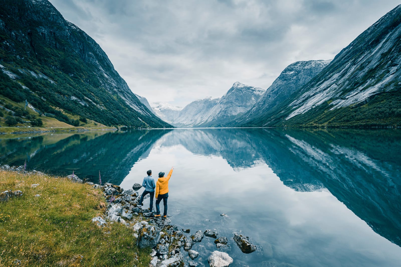 Travellers admiring a Norwegian fjord