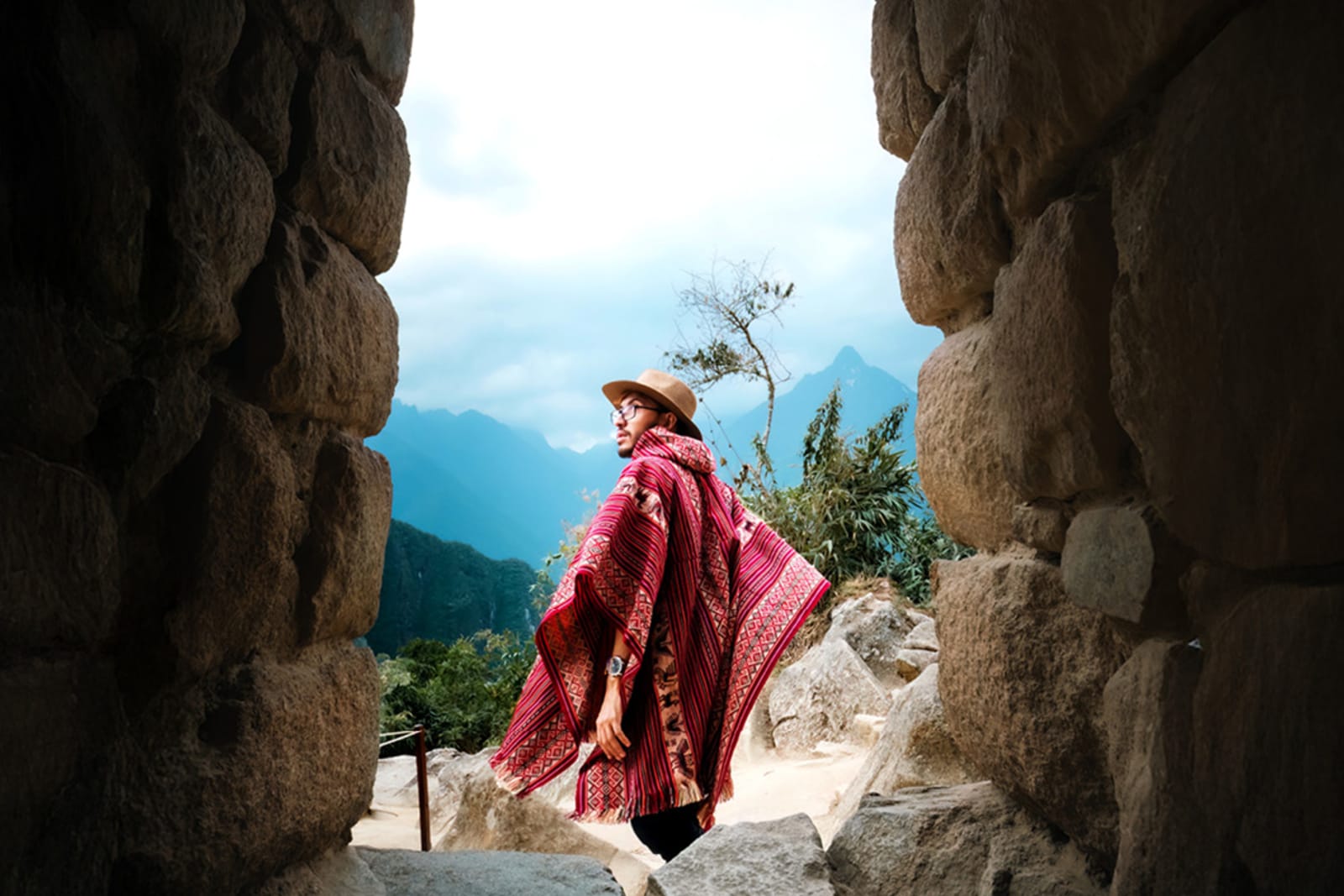 A traveller wearing a Peruvian poncho