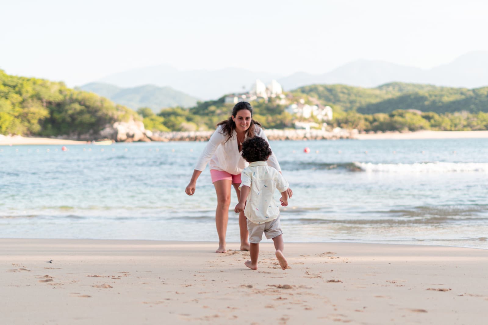 Mother and her young son on a beach in Mexico