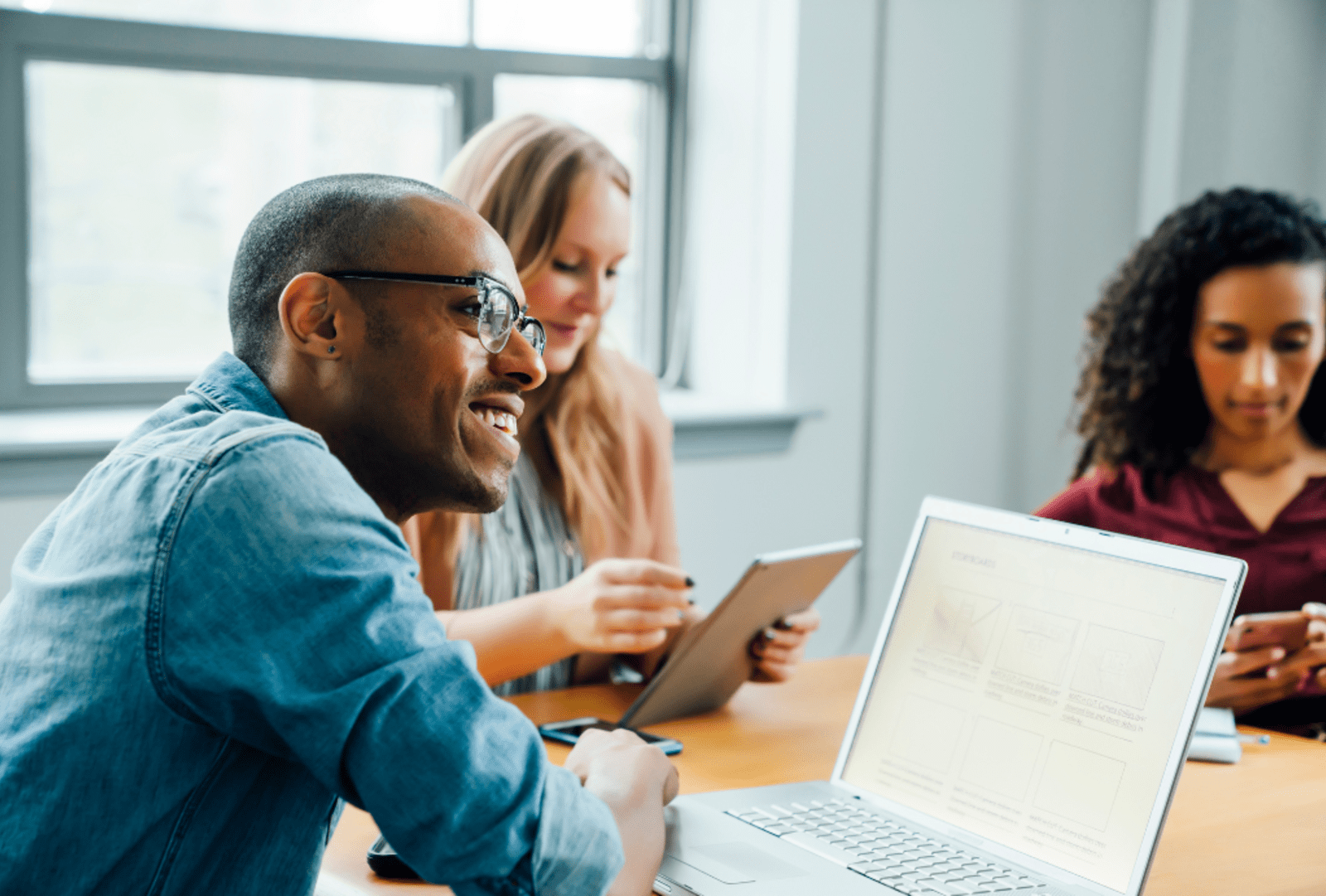 Business people using technology in meeting