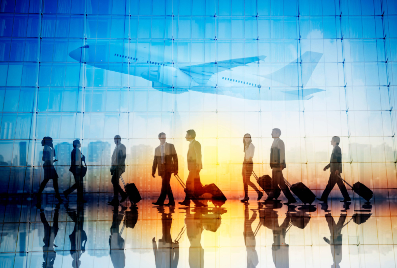 Group of Business Travellers Walking in an Airport