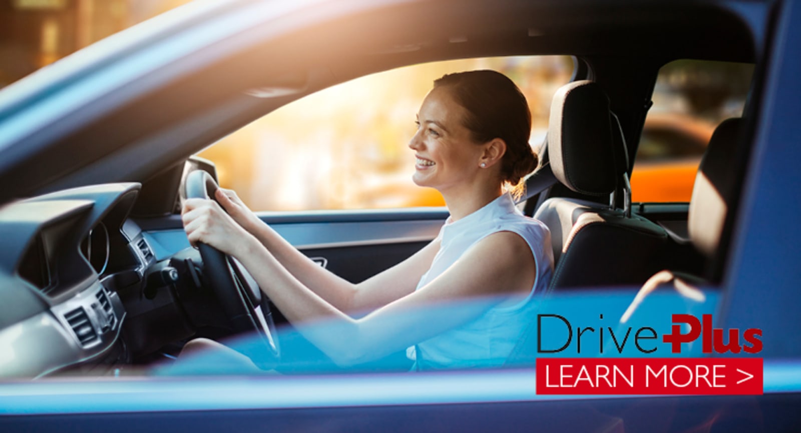 White woman driving a blue car