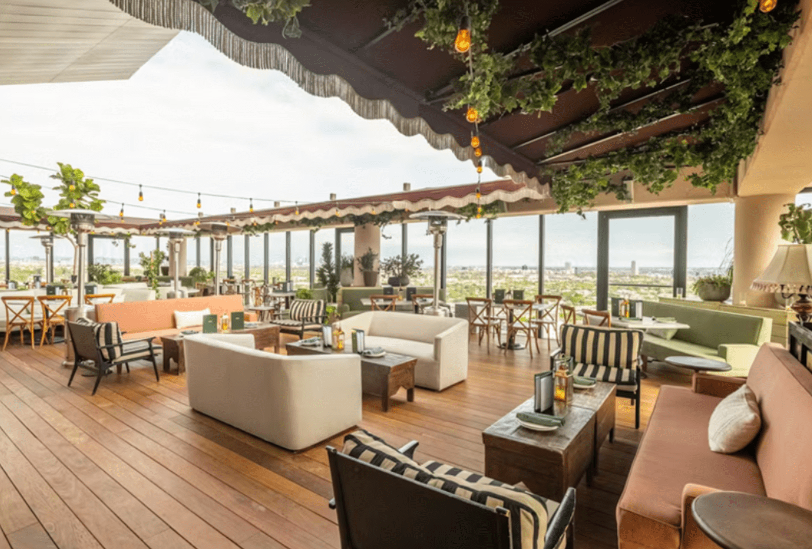 Open-air tables and chairs at Harriet's Rooftop Bar in West Hollywood
