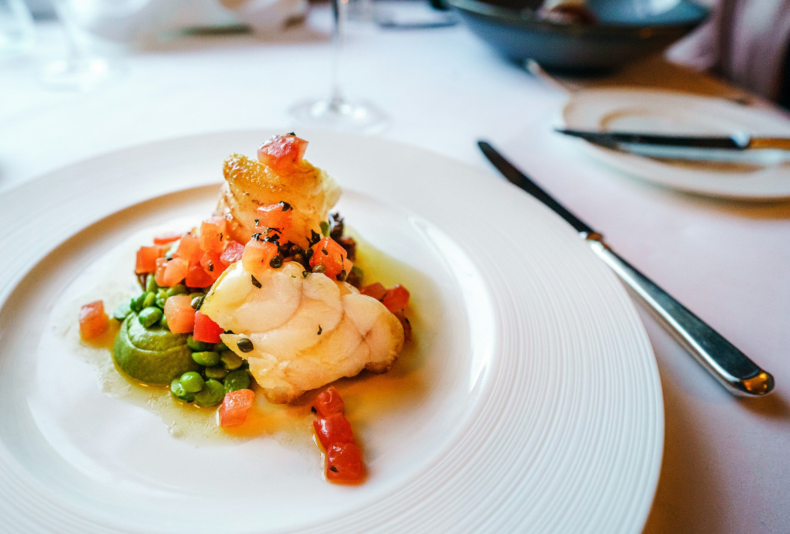A yummy seafood dish stacked on a big white plate