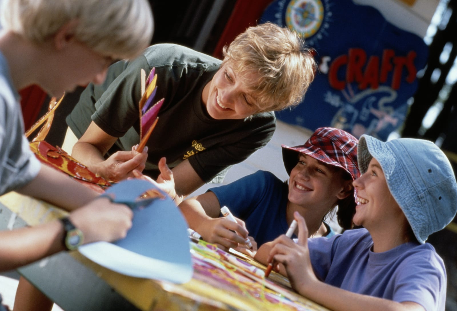 Person Teaching Students in Crafts at a Camp