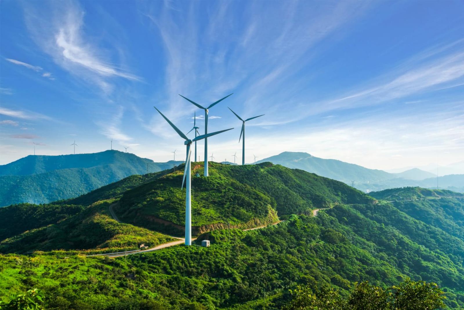 Three wind turbines on a hill