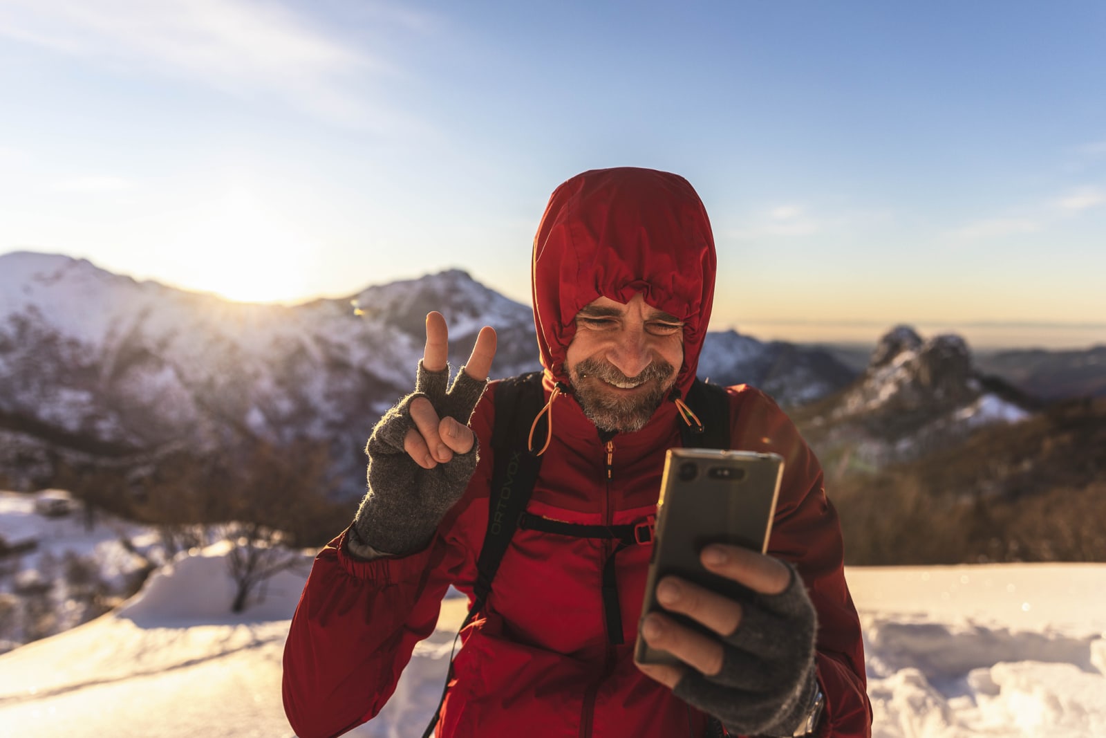 Man on mountain with phone