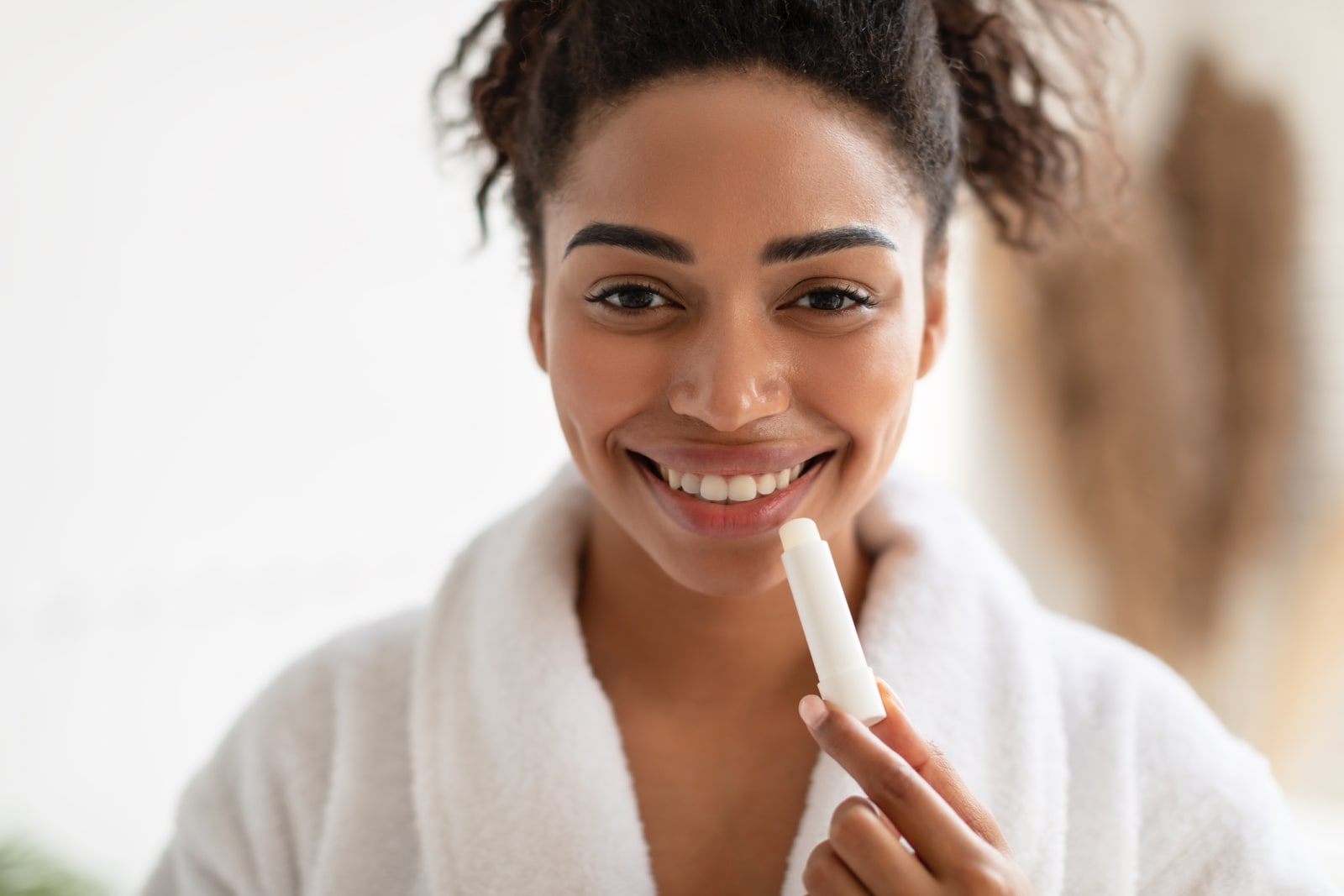 woman applying lipbalm
