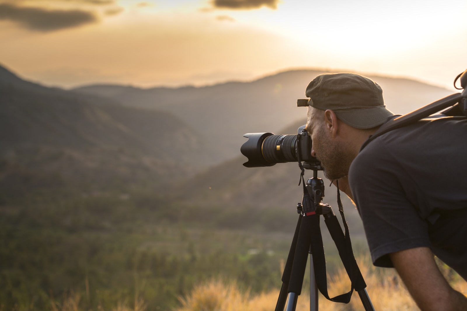 Man using tripod and camera