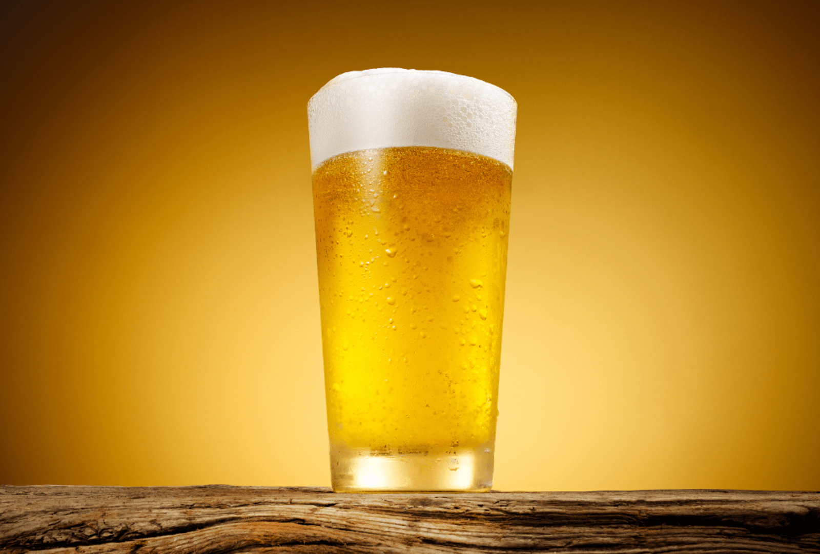Close-up of a frothy beer in a chilled glass