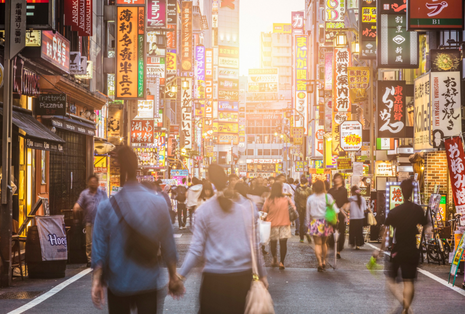 Signs proliferate the skyline in Shinju, Tokyo at sunset.
