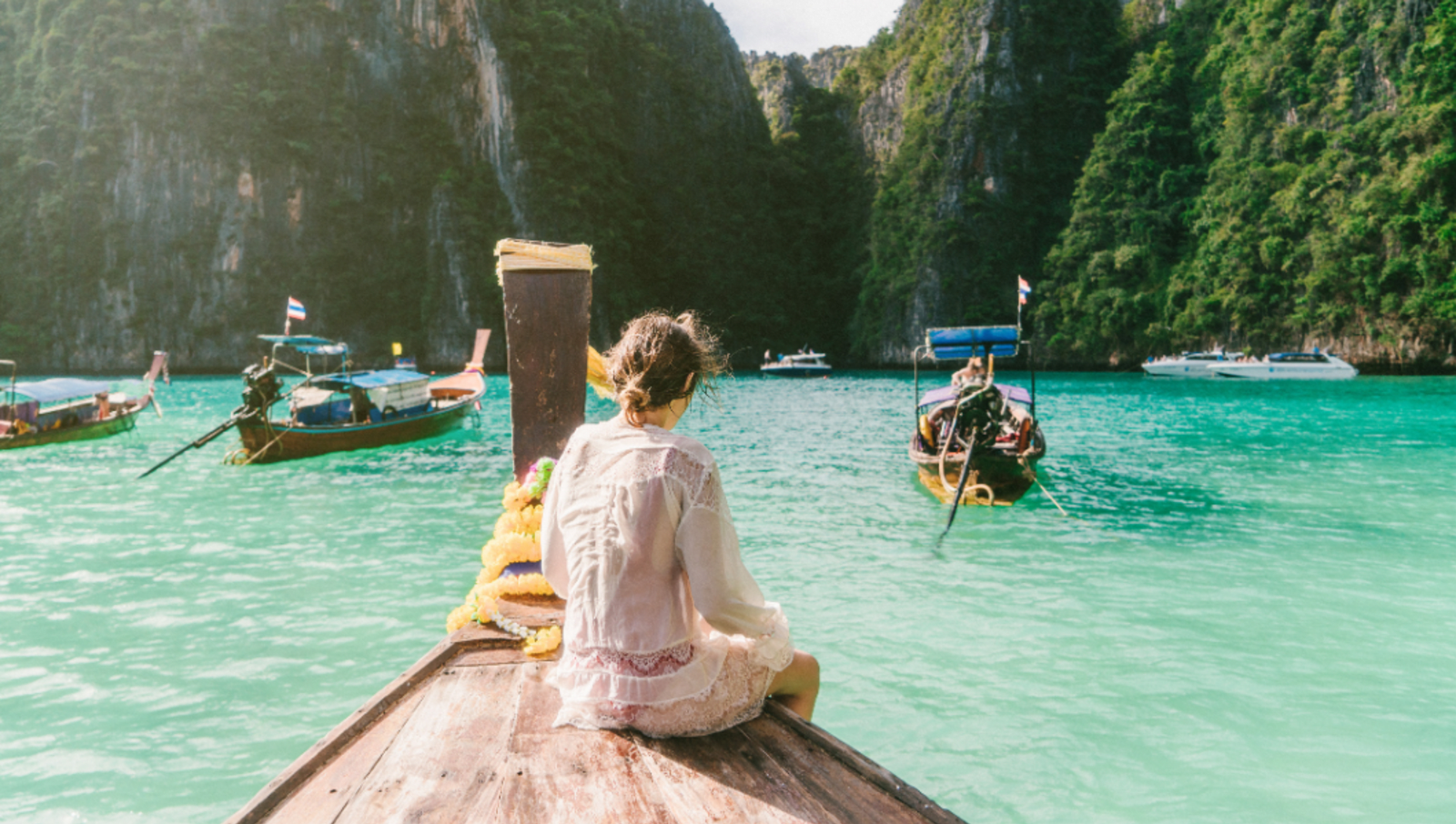 person on tax boat looking at cliffs of Koh Phi Phi 